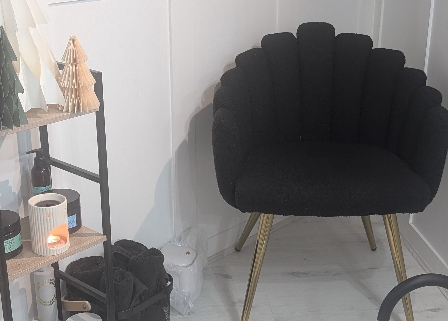 Stylish black chair and products at Beauty Corner, Ashford, England, GB