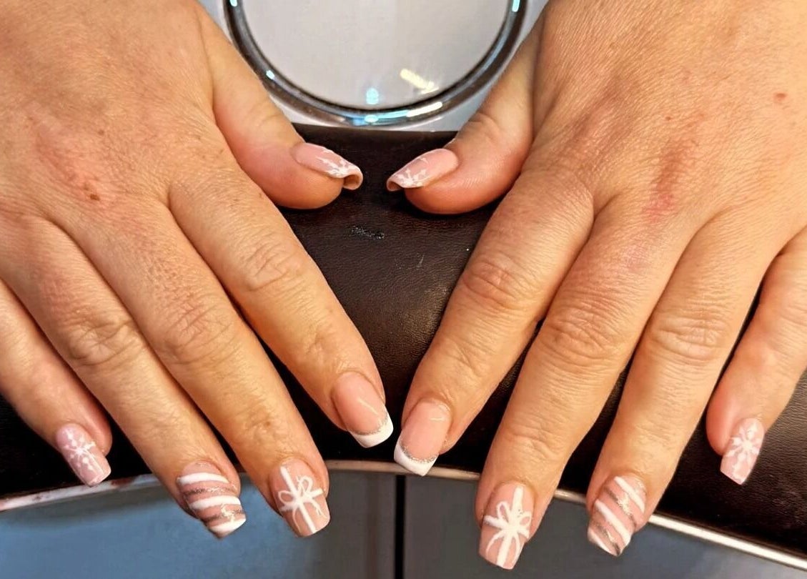 Elegant nail art featuring ribbons at Beauty Corner, Ashford, England, GB.