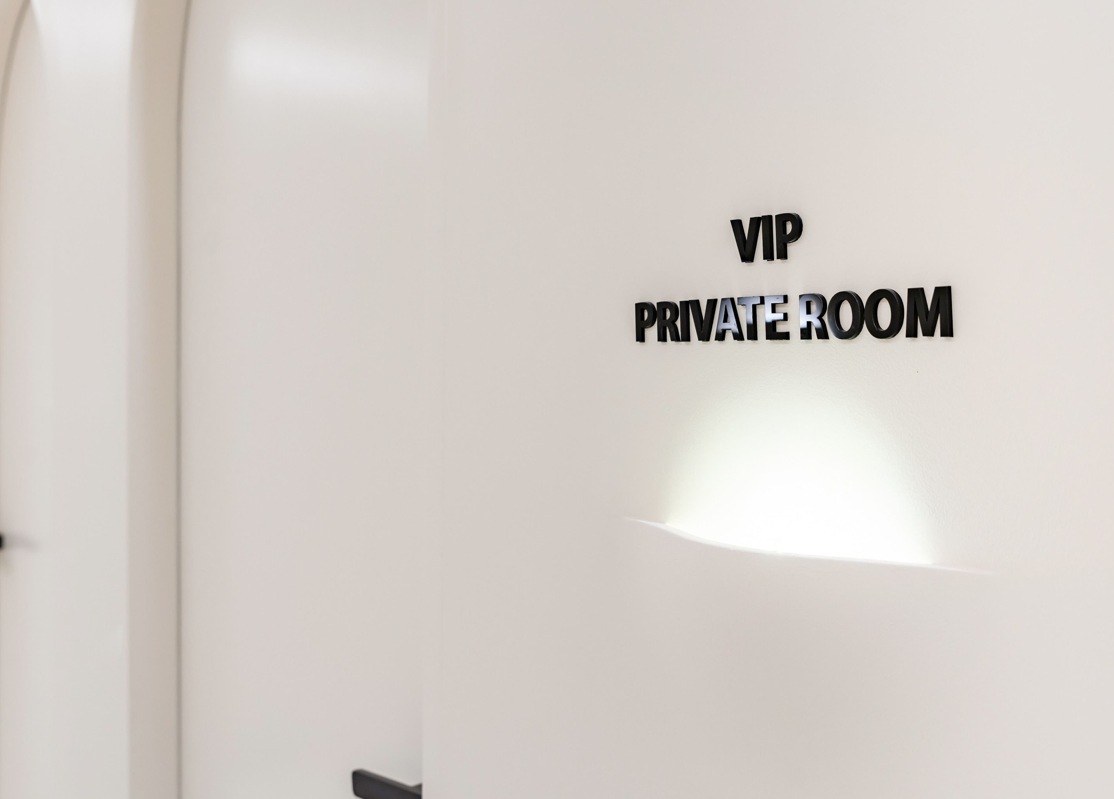 VIP private room at MEGUMI GLOBAL, Sydney, New South Wales, AU. Elegant white interior for exclusive treatments.