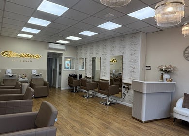 Elegant interior of Queens Hair & Beauty, Bristol, England, GB, featuring stylish chairs and modern decor.