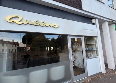 Front view of Queens Hair & Beauty in Bristol, England, GB showcasing its elegant salon entrance.