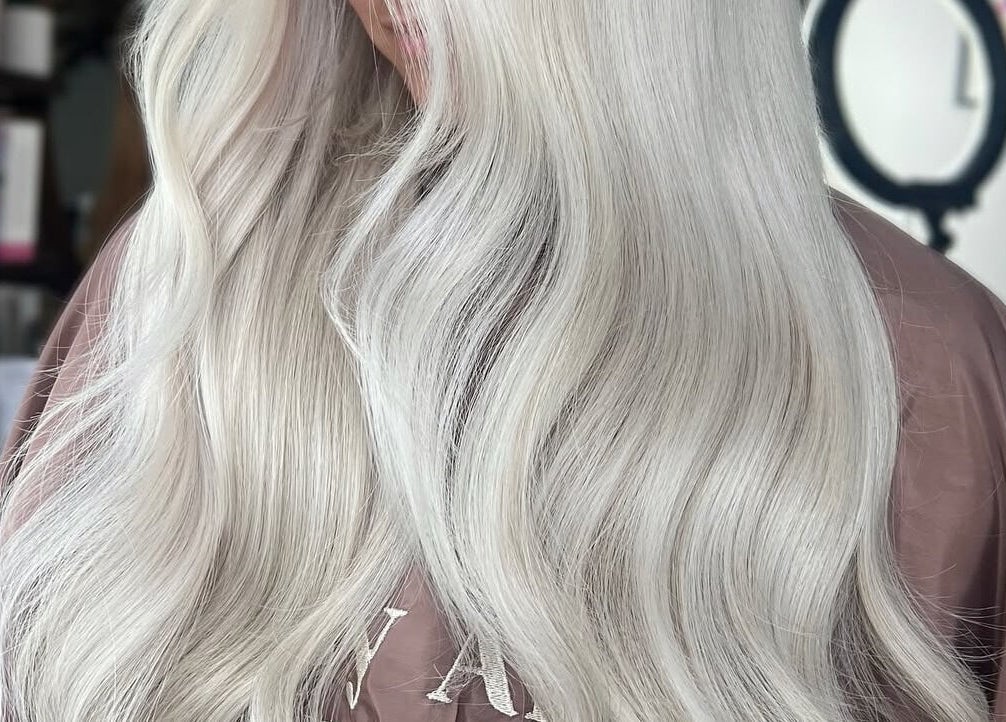 Elegant silver hair styling at Pembroke - By Ami in Pembroke, Wales, GB showing silky, wavy strands.