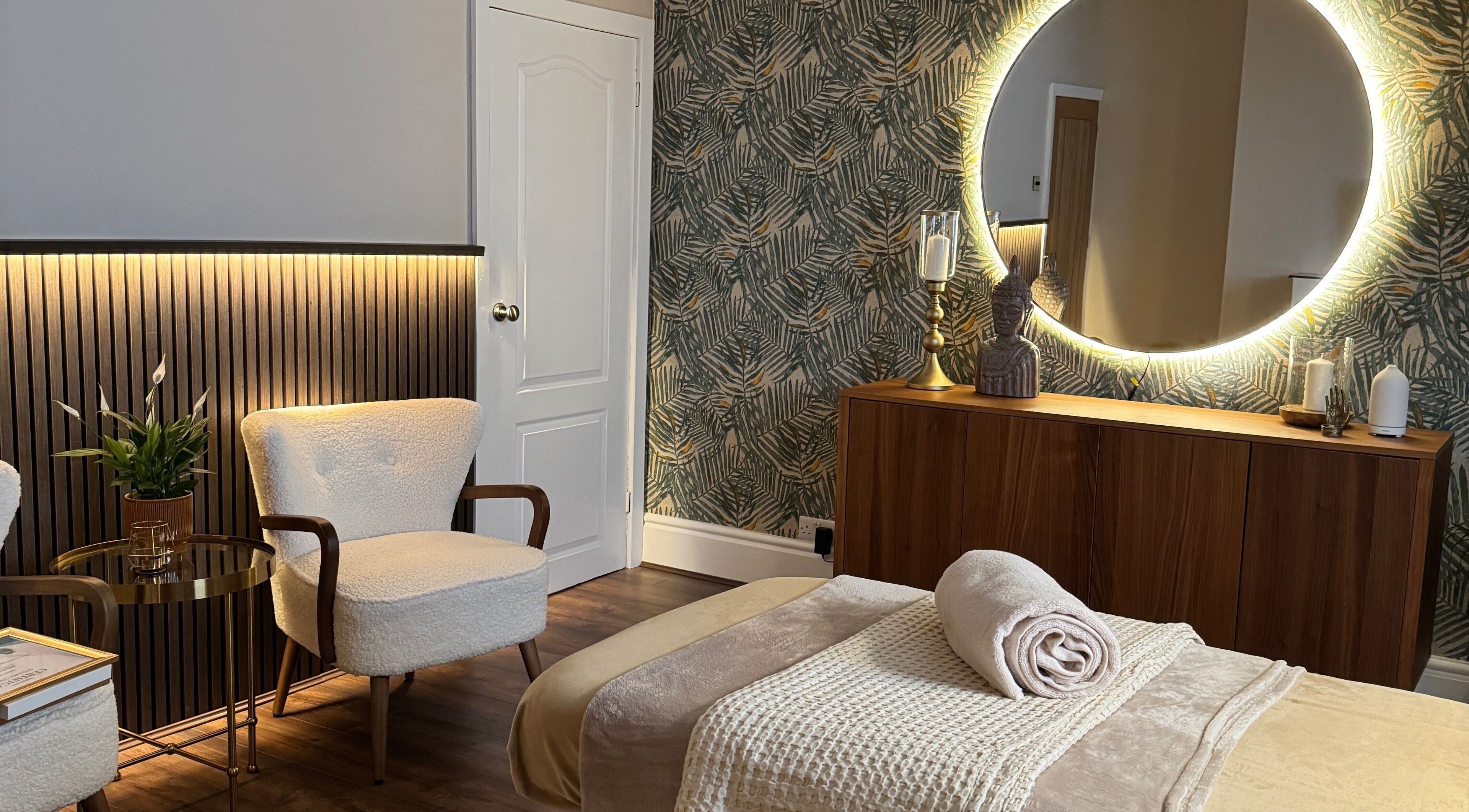 Relaxing spa room with cozy chairs and mirror at Cute Guru, West Bromwich, England, GB.