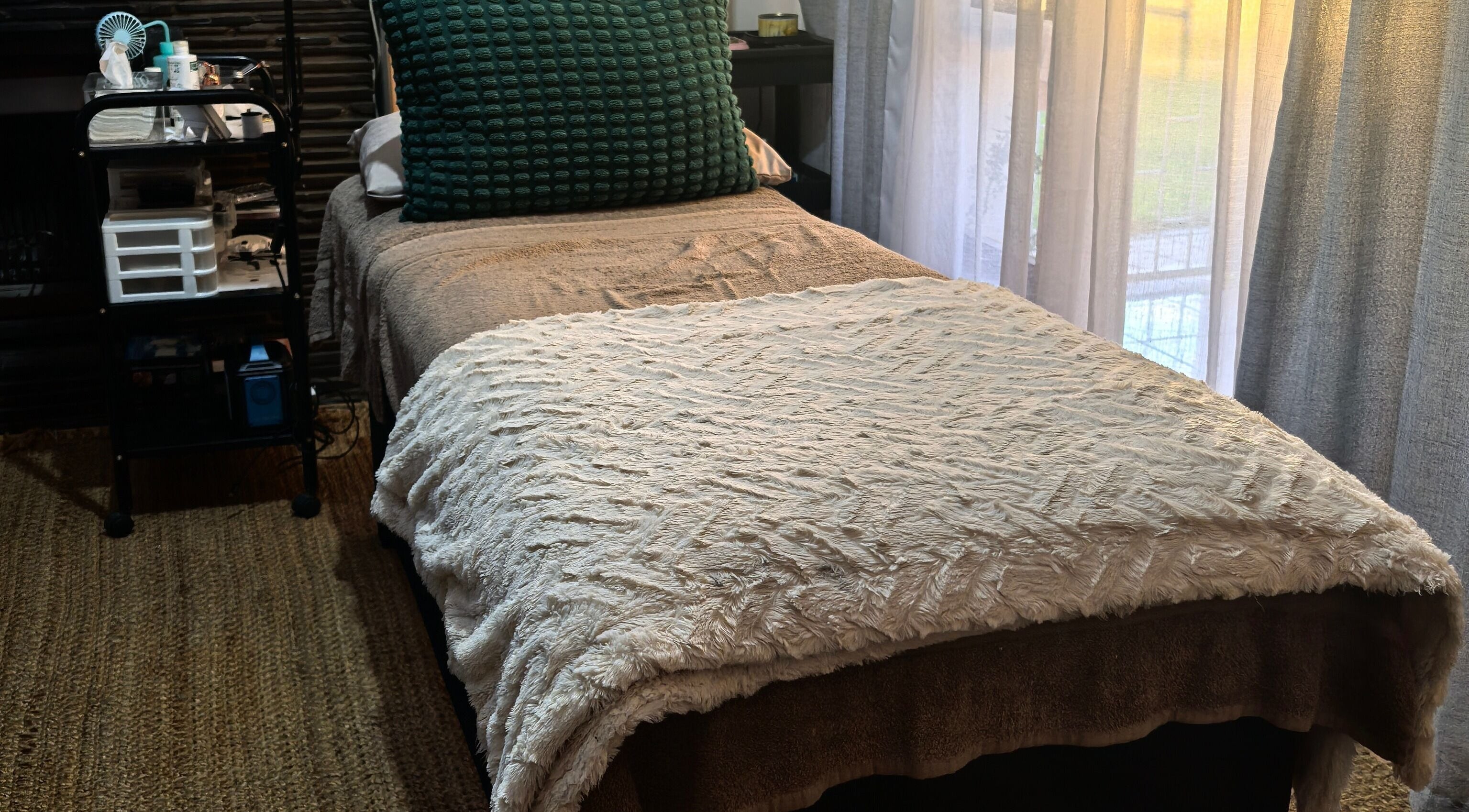 Tranquil treatment bed at TBeauty, Cape Town, Western Cape, ZA, exuding a warm and inviting atmosphere.