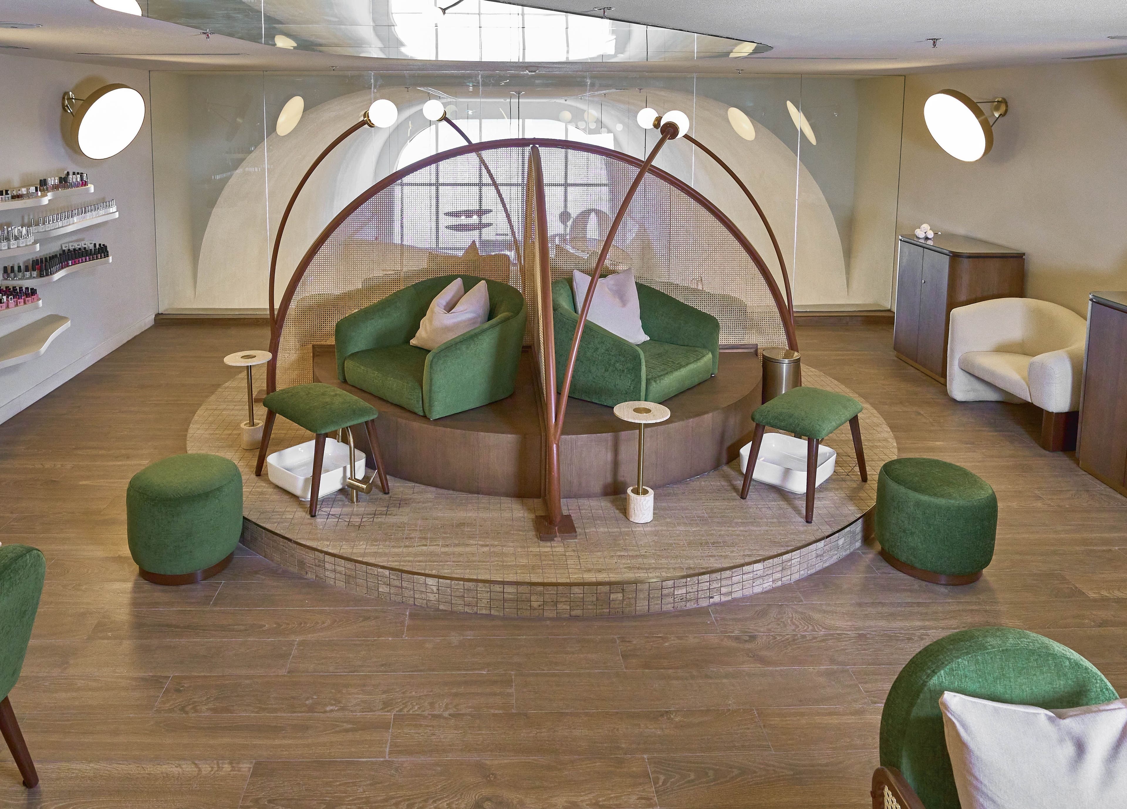 Relaxing pedicure lounge at Obar Beauty, Riyadh, Riyadh Province, SA, featuring elegant green seating and chic decor.