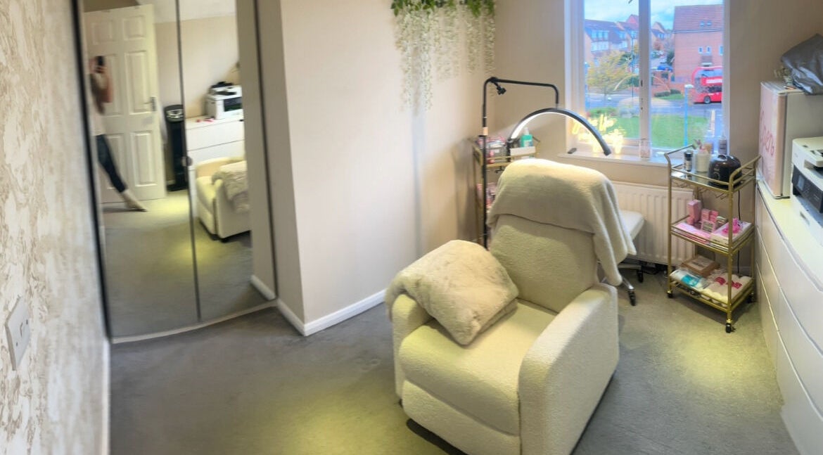 Relaxing chair at Charlie May’s Beauty Room in Wallington, England, GB, with window view and elegant decor.