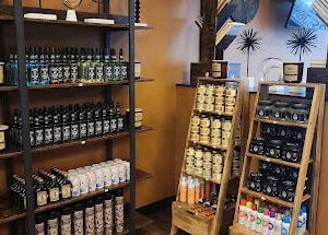 Masters Barbershop in Alpharetta, Georgia, US showcasing a well-stocked product display shelf.