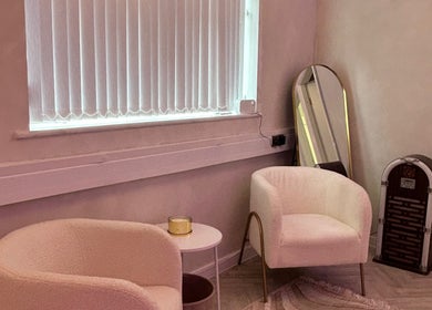 Cozy seating area at Laser Luxe Clinic, Rochdale, England, GB, featuring modern chairs and decor.