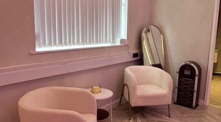 Cozy seating area at Laser Luxe Clinic, Rochdale, England, GB, featuring modern chairs and decor.