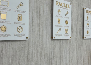 Aftercare advice boards at Laser Luxe Clinic, Rochdale, England, GB, detailing skincare tips after treatments.
