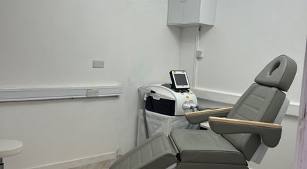 Comfortable treatment room with laser equipment at Laser Luxe Clinic in Rochdale, England, GB.