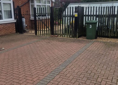 Entrance pathway at Wilmslow Avenue, Woodbridge, featuring a welcoming brick design. Located in Woodbridge, England, GB.