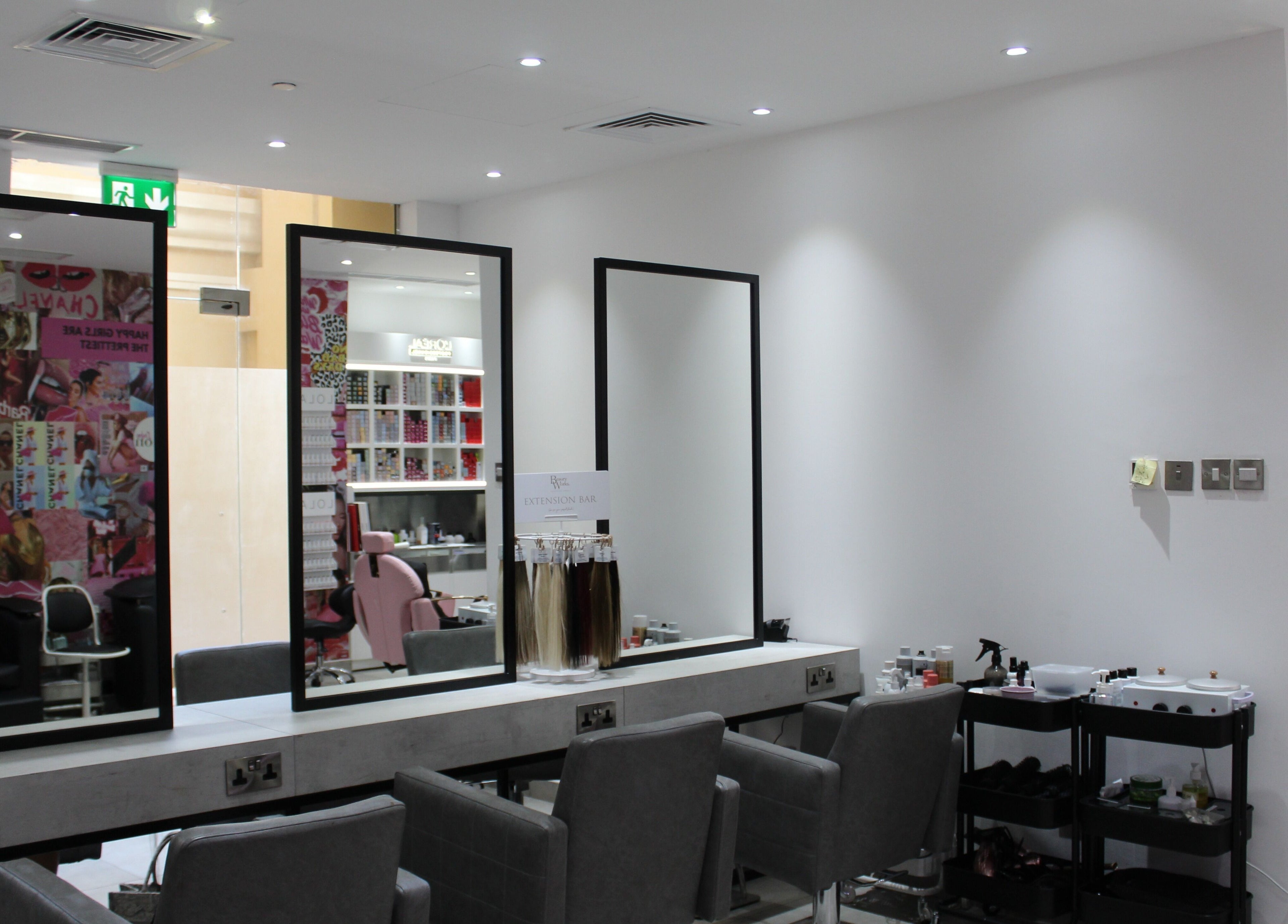 Sleek salon interior at The Salon at Yin Yang JBR, Dubai, AE with elegant styling stations and vibrant decor.