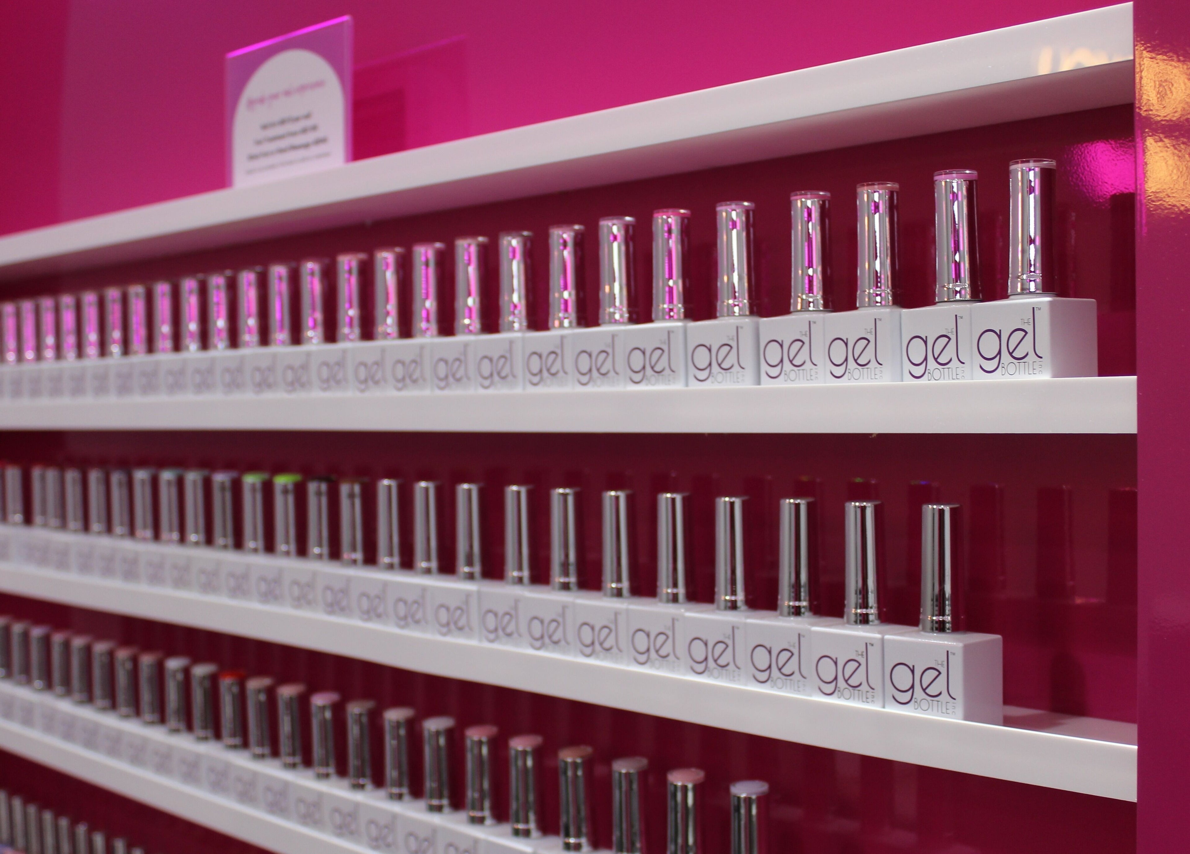 Nail polish display at The Salon at Ocean View Hotel JBR, Dubai, AE. Vibrant gel bottles neatly aligned.