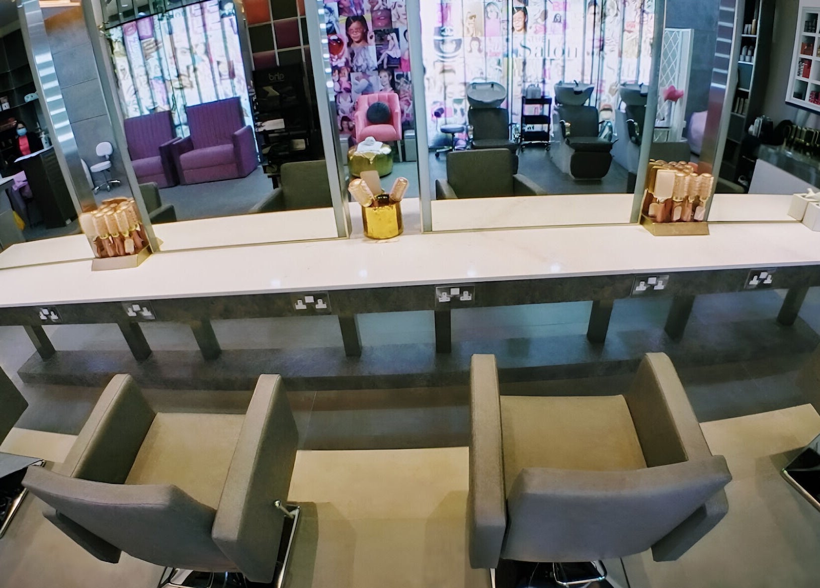 Modern salon interior at The Salon at Yin Yang Al Wasl, Dubai, AE with sleek chairs and vibrant decor.