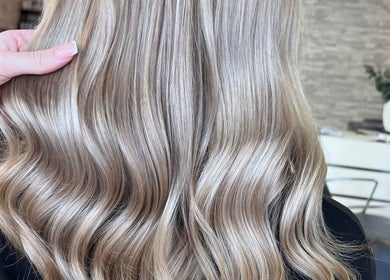 Blonde hair with soft waves styled at Poppy Harrison Hair in Blackpool, England, GB.