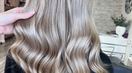 Blonde hair with soft waves styled at Poppy Harrison Hair in Blackpool, England, GB.