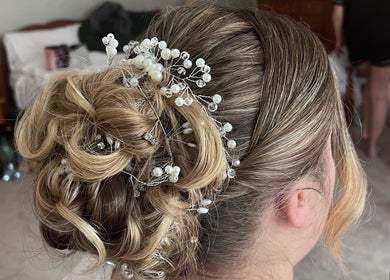 Intricate bridal updo with pearls at Poppy Harrison Hair, Blackpool, England, GB.