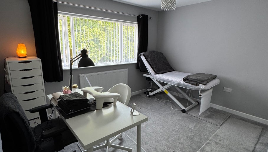 Relaxatonic treatment room with massage table and salt lamp in Walsall, England, GB.
