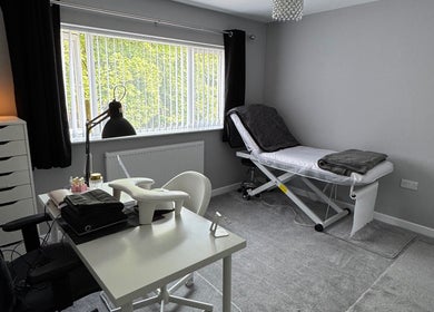Relaxatonic treatment room with massage table and salt lamp in Walsall, England, GB.