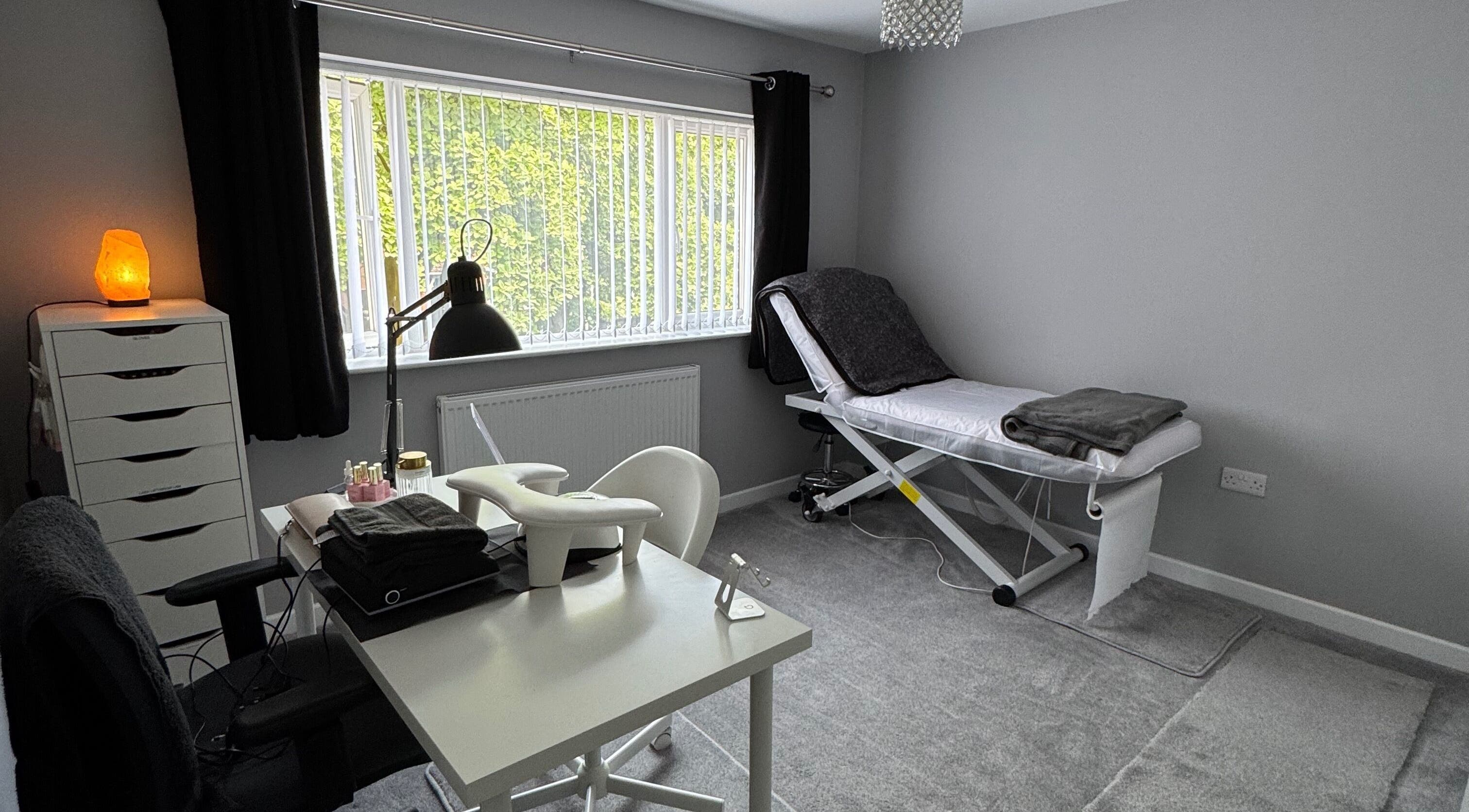 Relaxatonic treatment room with massage table and salt lamp in Walsall, England, GB.