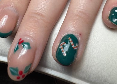 Festive nail art with holly, candy cane at Relaxatonic, Walsall, England, GB.