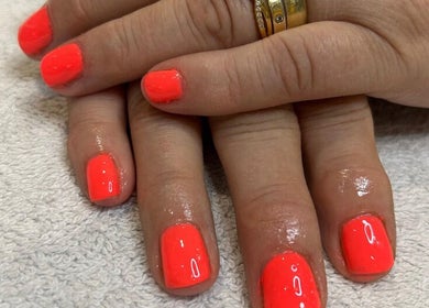 Bright coral nails showcased at Relaxatonic, Walsall, England, GB, perfect for a refreshing look.