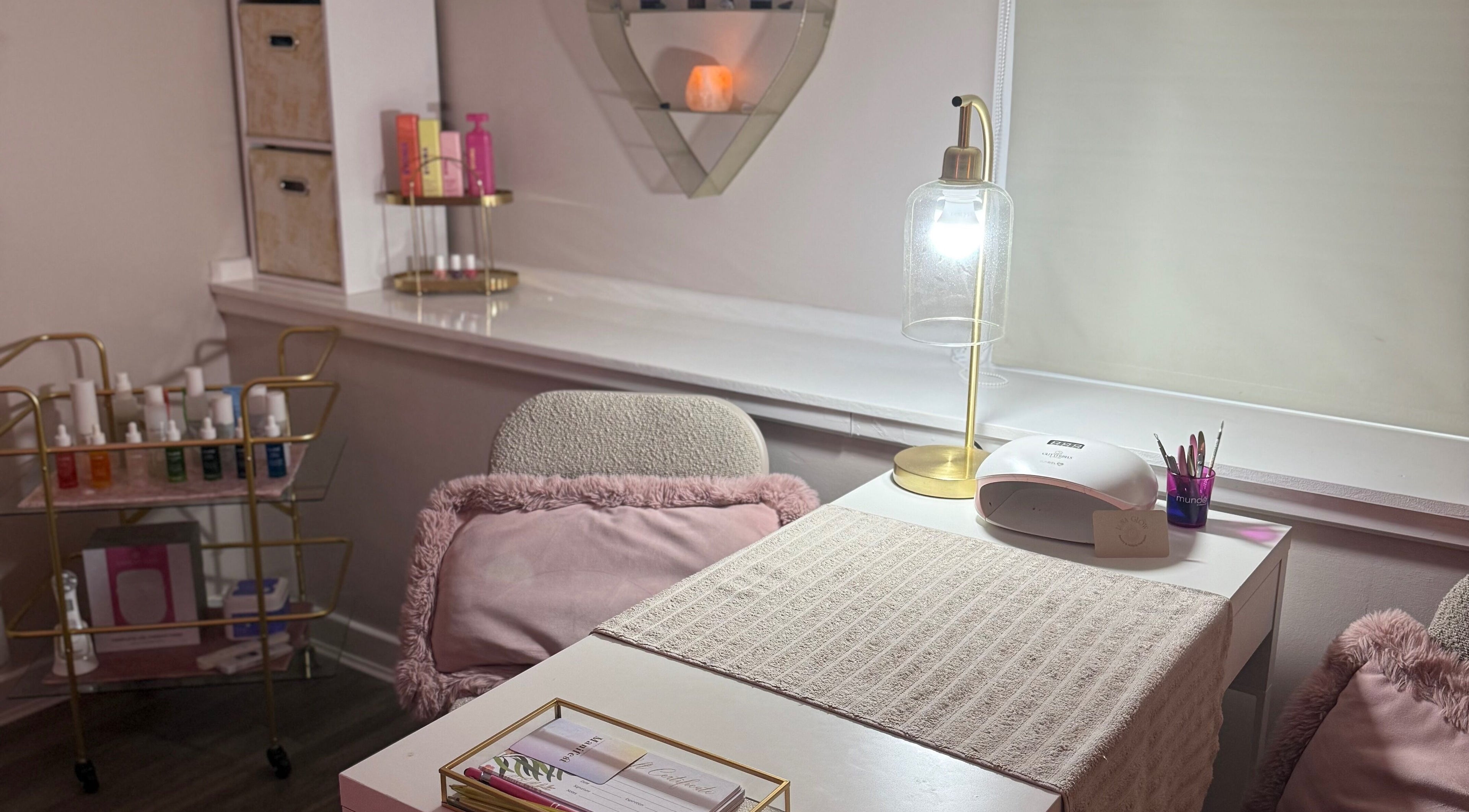 Cozy nail station at Luna∙Glow Beauty & Holistic Therapies in East Kilbride, Scotland, GB, with soft lighting.