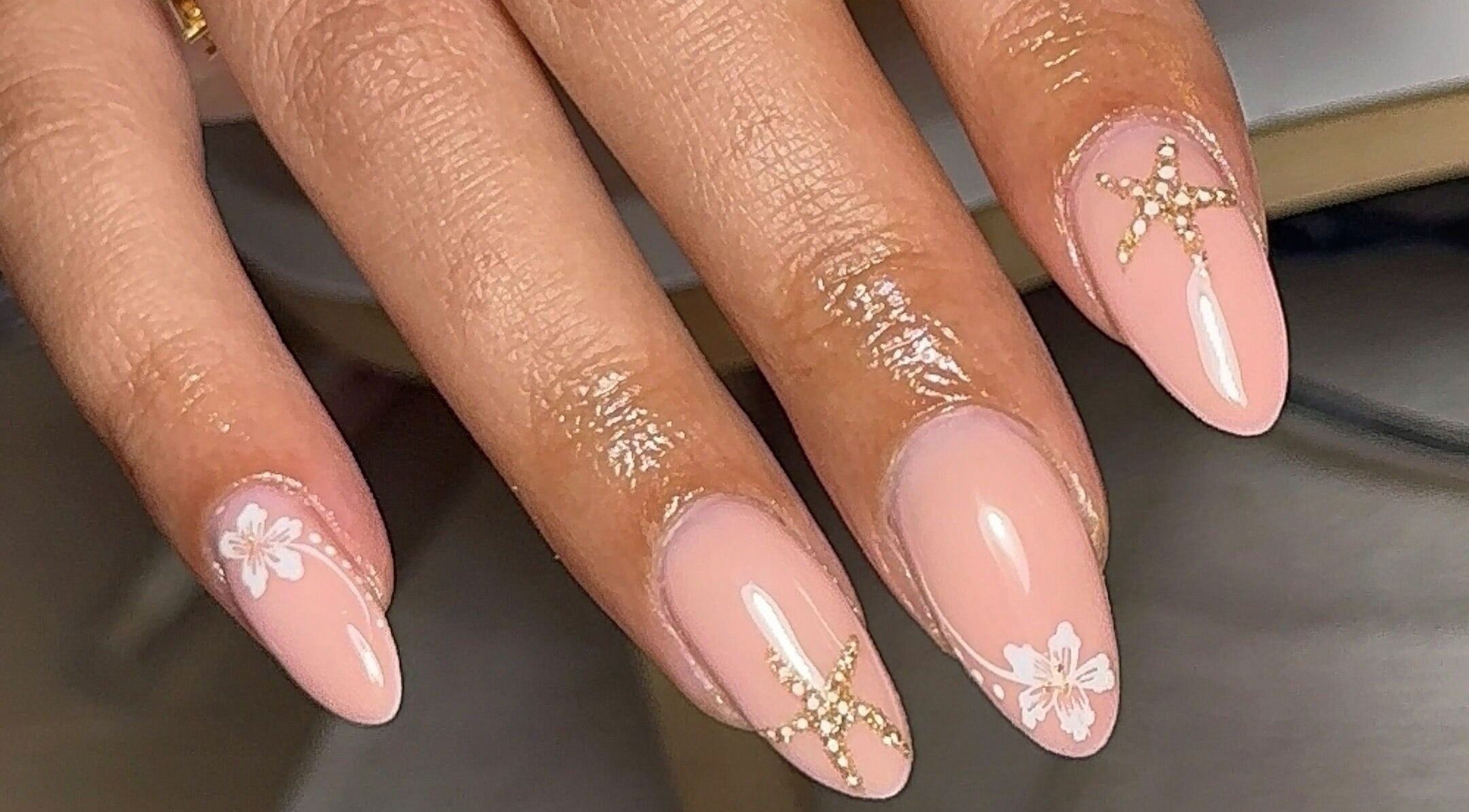 Chic nail design with floral accents at BY.M.R.B, Colchester, England, GB. Perfect for elegant occasions.