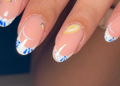 Beautiful blue floral nail art at BY.M.R.B, Colchester, England, GB showcasing intricate design.