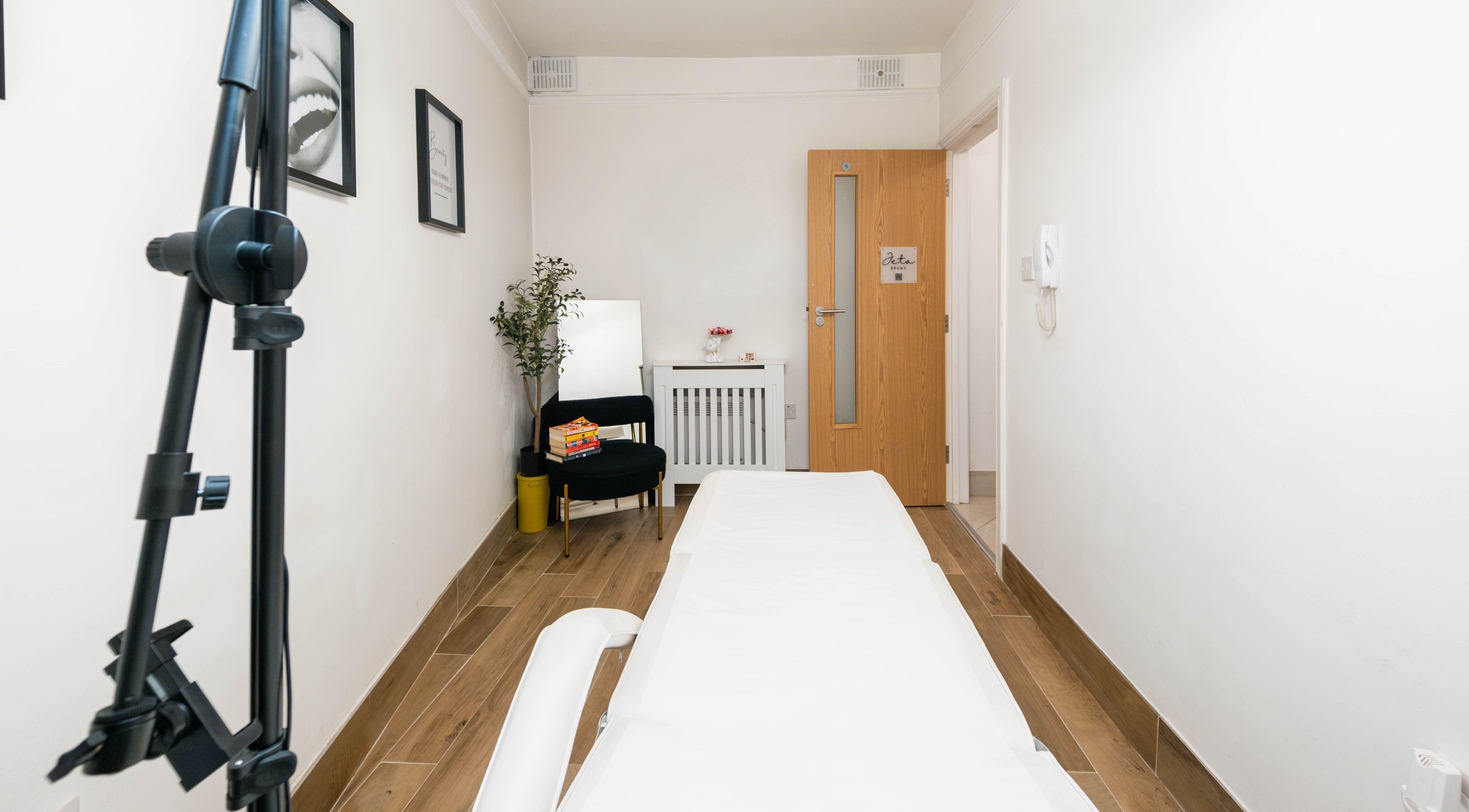 Cozy treatment room at Jeta Brows, London, England, GB, highlighting comfort and relaxation.