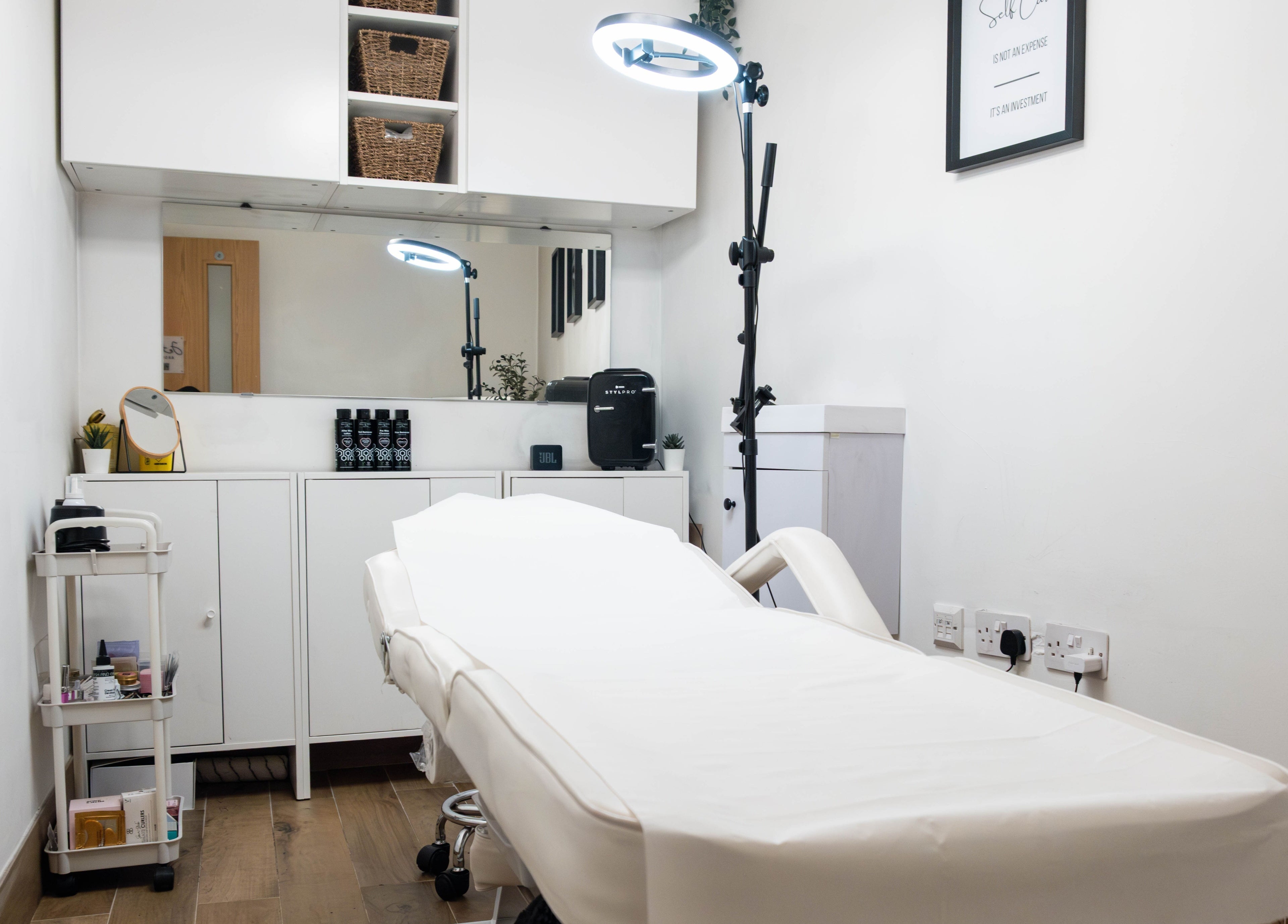 Jeta Brows treatment room in London, England, GB. Modern, tranquil space with a treatment bed and beauty tools.