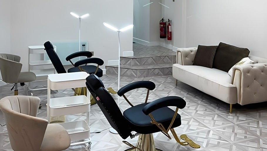 Elegant seating area at Faces by Holly Eastwood, Morecambe, England, GB showcasing luxurious salon interiors.