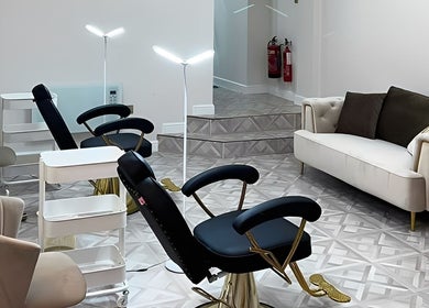 Elegant seating area at Faces by Holly Eastwood, Morecambe, England, GB showcasing luxurious salon interiors.