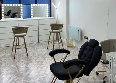 Luxurious beauty studio at Faces by Holly Eastwood, Morecambe, England, GB, with elegant chairs and vanity mirrors.