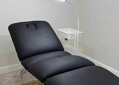 Modern treatment chair at Faces by Holly Eastwood, Morecambe, England, GB for wellness services.