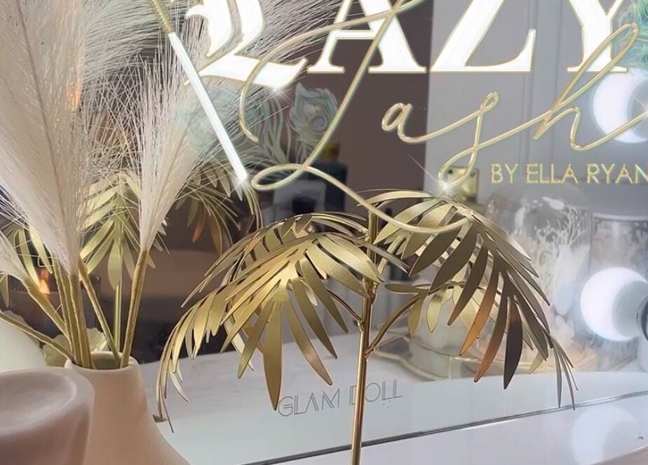 Elegant decor at Lazy Lash, Dublin, County Dublin, IE with gold accents and soft lighting.