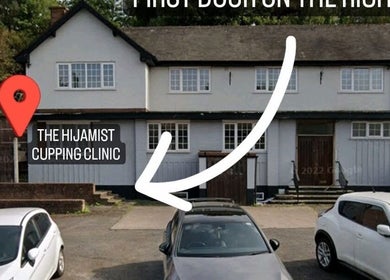Front view of The Hijamist, a cupping clinic in Stourbridge, England, GB with parked cars in front.