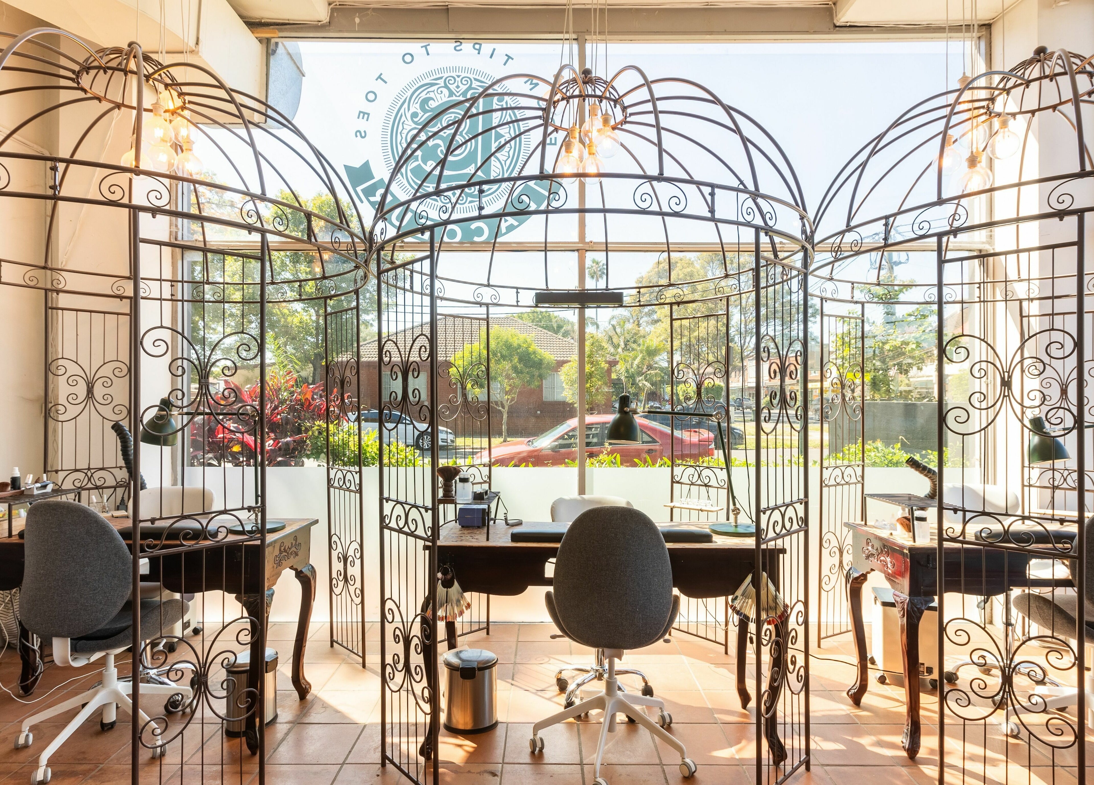 Elegant nail stations at La Coeur - Rosebery, Rosebery, New South Wales, AU with ornate metal dividers.