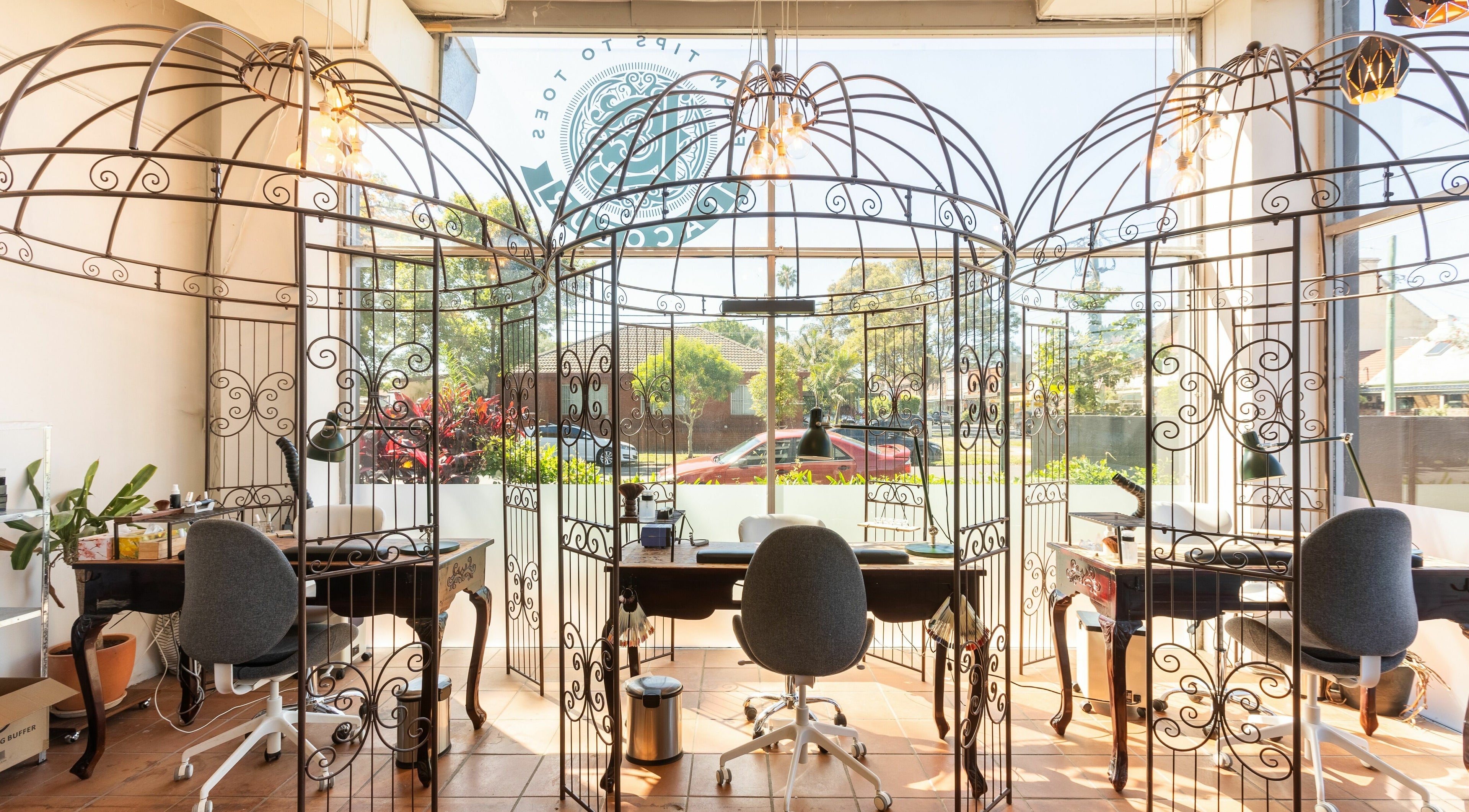 Elegant nail stations at La Coeur - Rosebery, Rosebery, New South Wales, AU with ornate metal dividers.