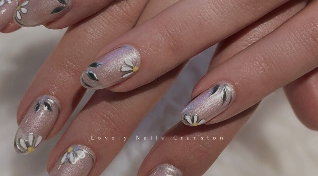 Delicate daisy nail art at Lovely Nails Spa, Cranston, Rhode Island, US, showcasing intricate floral design.