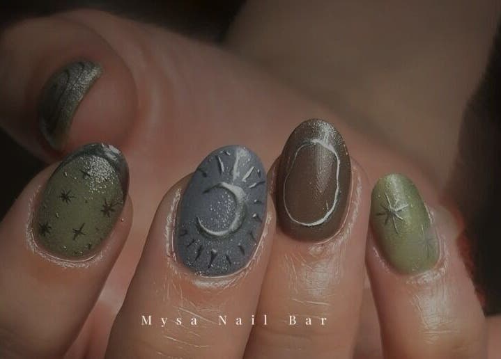 Celestial nail art featuring stars and crescent designs at Mysa Nail Bar, Boston, Massachusetts, US.