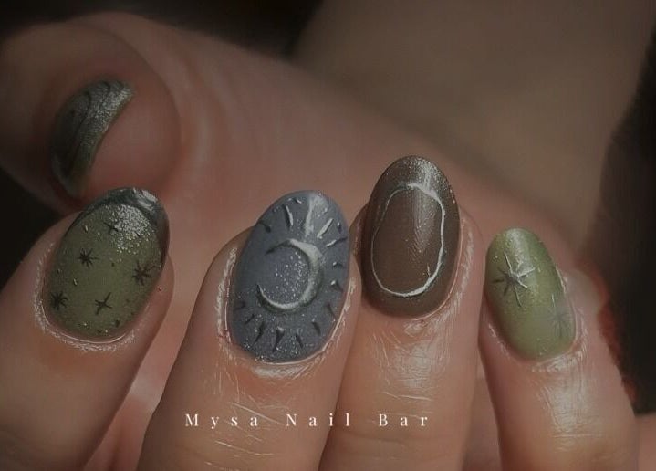 Celestial nail art featuring stars and crescent designs at Mysa Nail Bar, Boston, Massachusetts, US.