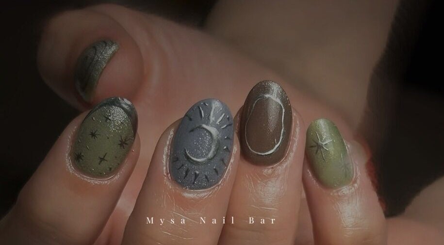Celestial nail art featuring stars and crescent designs at Mysa Nail Bar, Boston, Massachusetts, US.