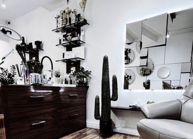 Chic modern salon interior at Lash Centre, Portsmouth, England, GB with stylish decor and comfortable seating.