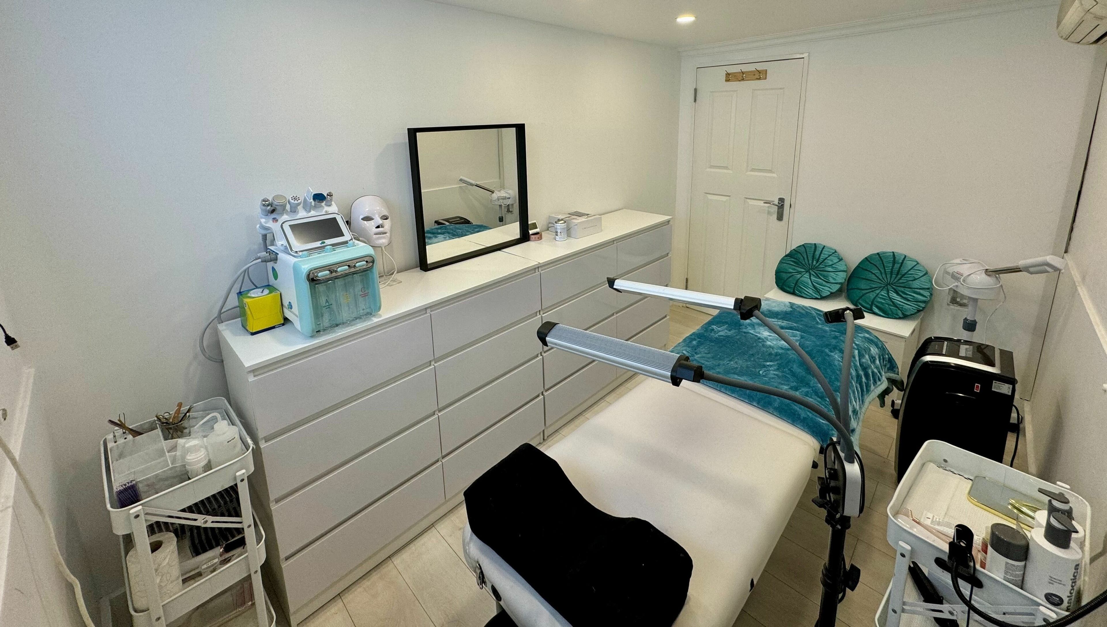 Elegant treatment room at Victoria Beauty and Aesthetics, London, England, GB, featuring modern equipment and decor.