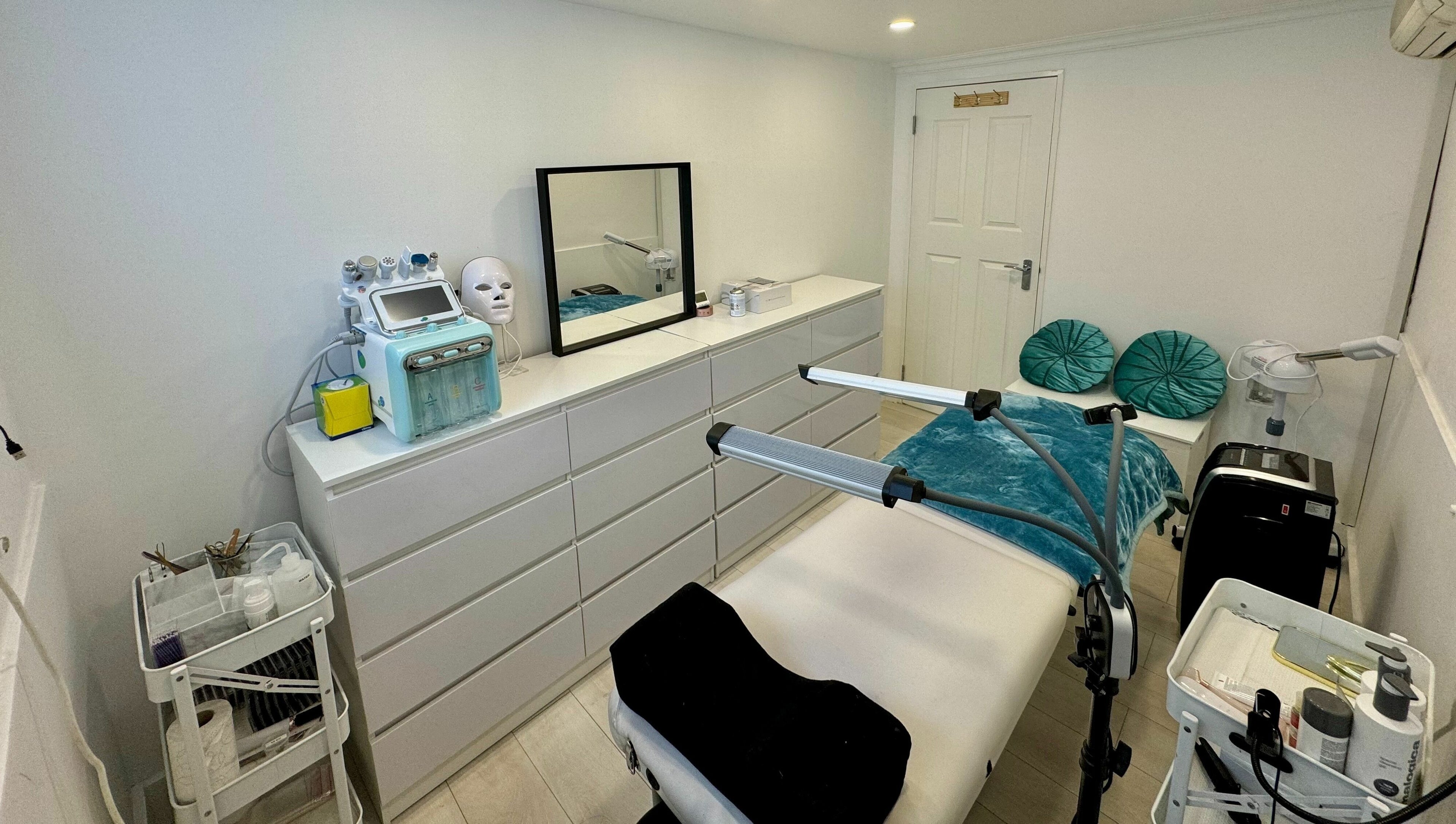 Elegant treatment room at Victoria Beauty and Aesthetics, London, England, GB, featuring modern equipment and decor.