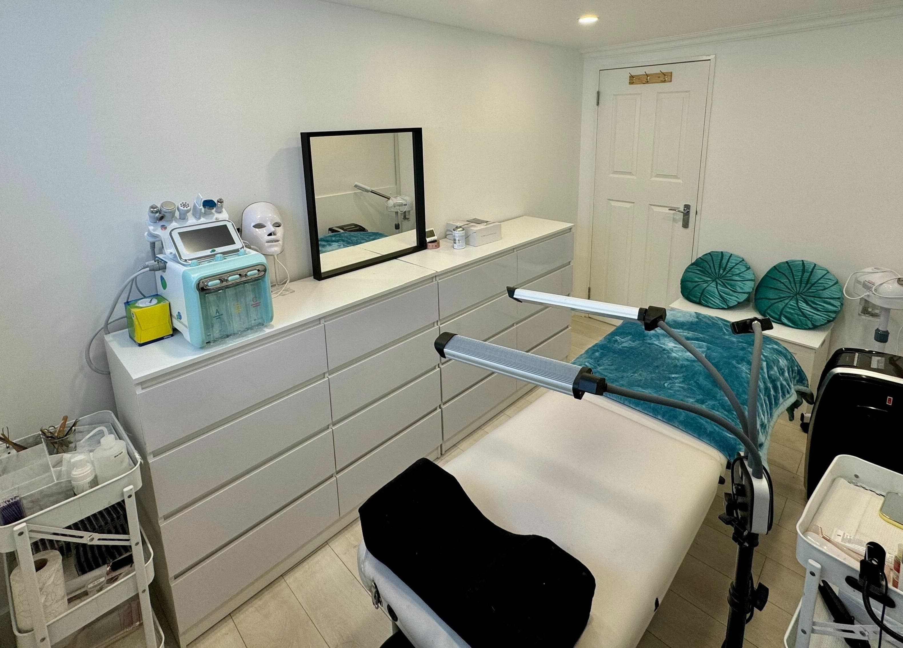 Elegant treatment room at Victoria Beauty and Aesthetics, London, England, GB, featuring modern equipment and decor.