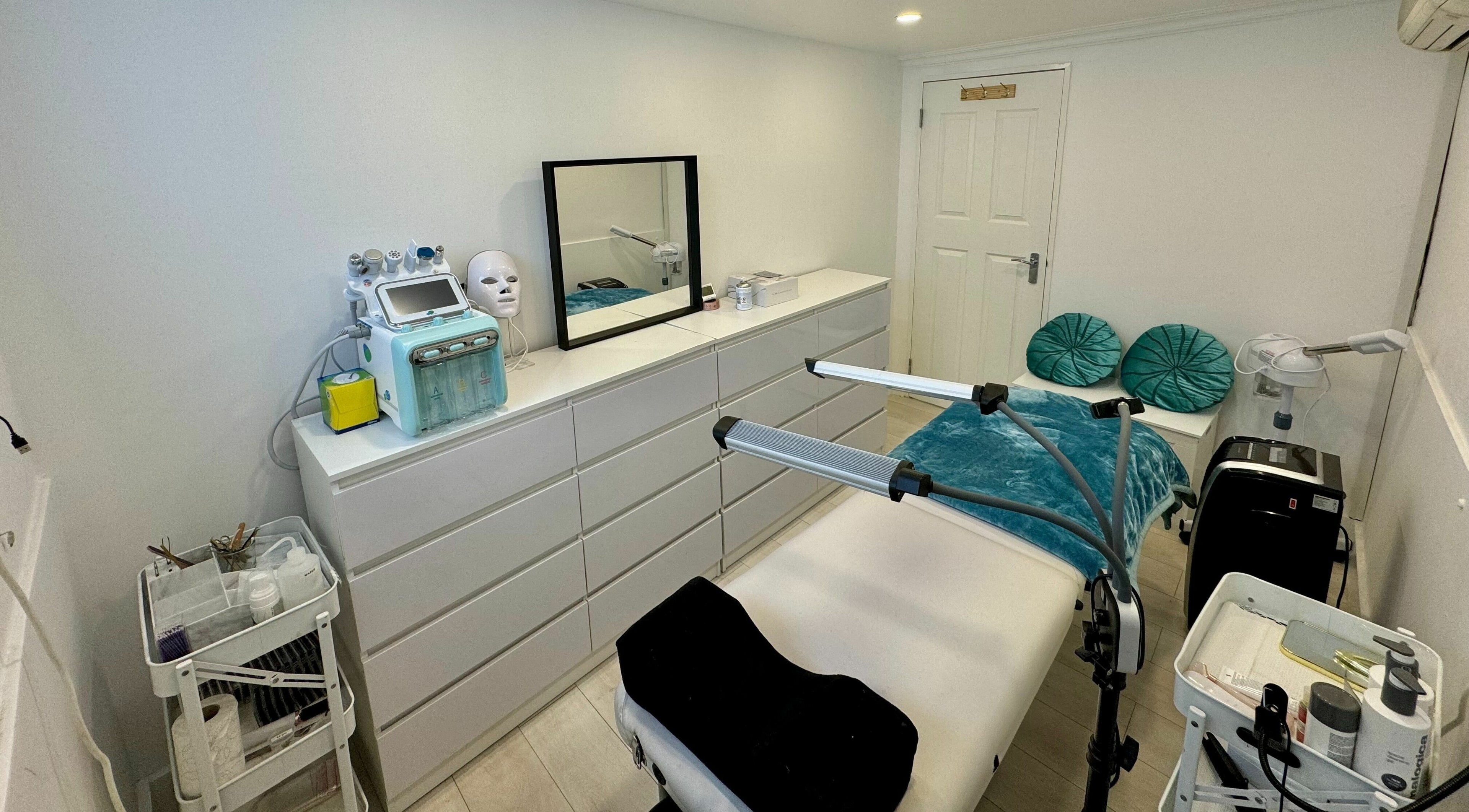 Elegant treatment room at Victoria Beauty and Aesthetics, London, England, GB, featuring modern equipment and decor.