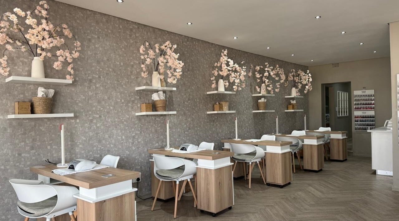 Elegant nail stations at Jacqui J Beauty Salon in Johannesburg, Gauteng, ZA, adorned with cherry blossom decor.